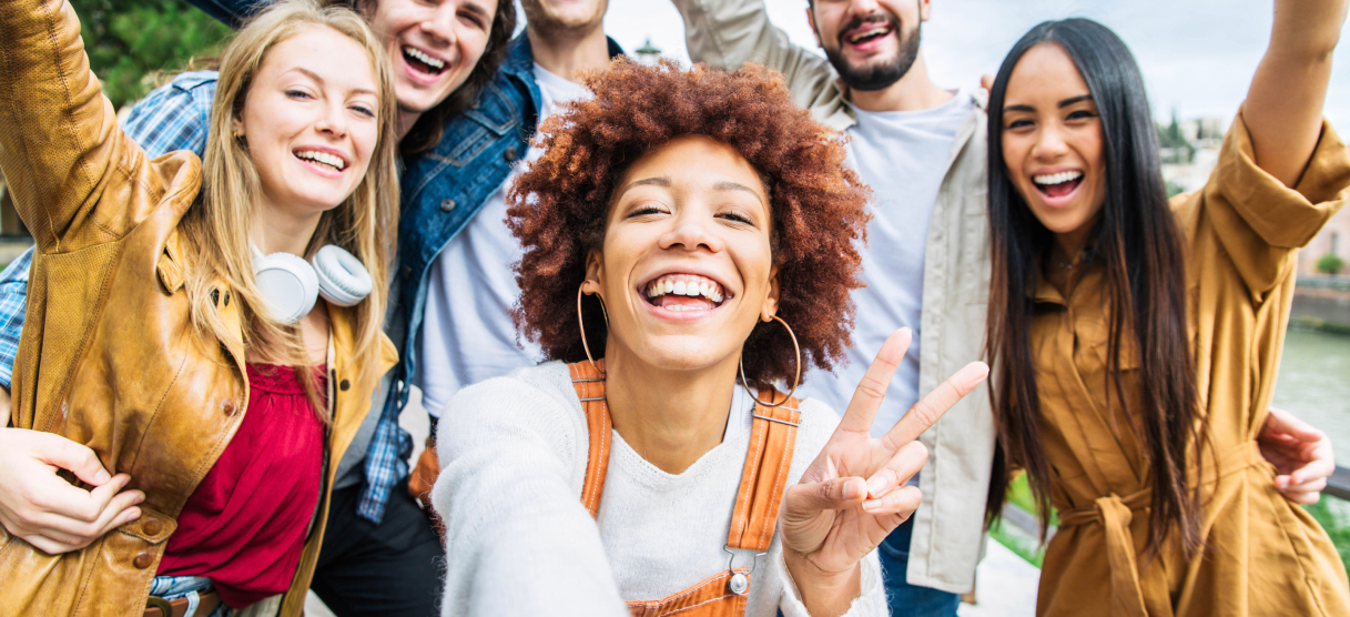 smiling group of friends taking a selfie